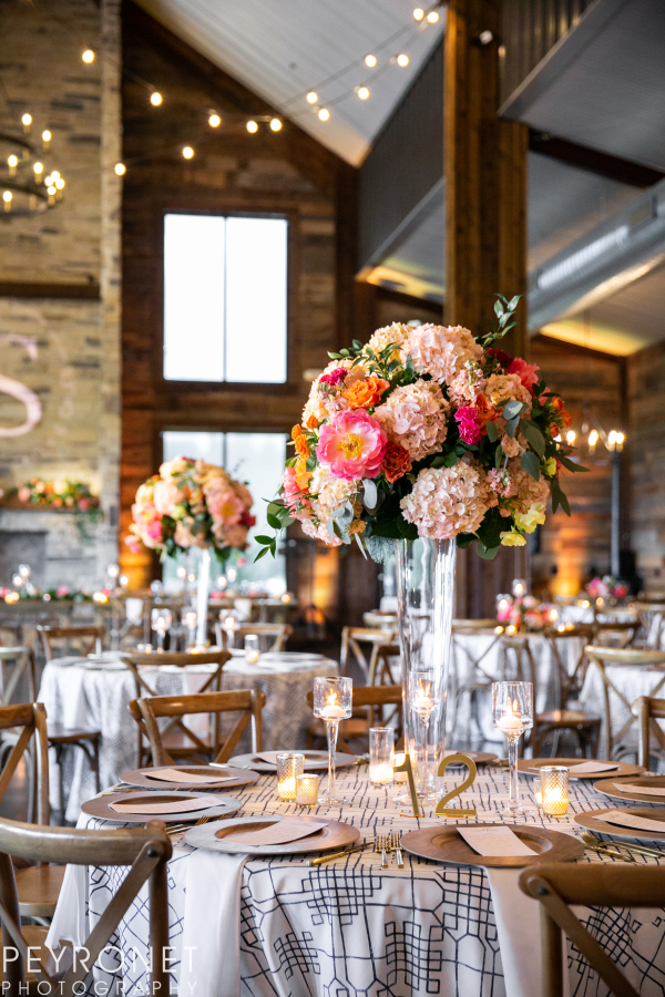 Rustic barn wedding table with pink centerpiece